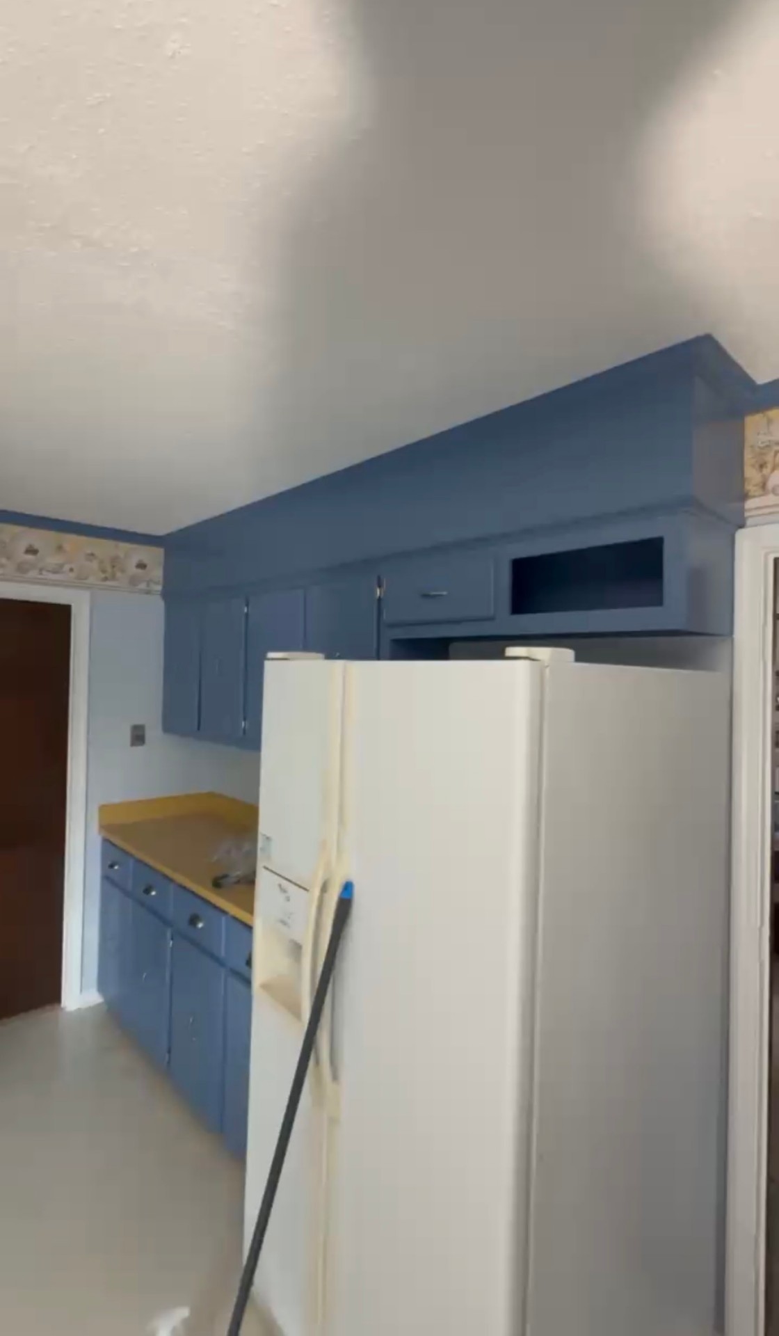 After: Kitchen cabinets refinished in a deep blue satin finish after professional cabinet painting — Dated Oak Kitchen to Modern Blue, Cabinet Painting by CJC Remodeling