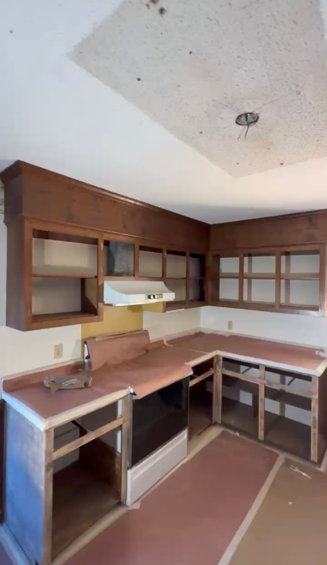 Before: Dark kitchen cabinets being degreased and sanded in preparation for refinishing — Kitchen Cabinet Refinish, Cabinet Painting by CJC Remodeling