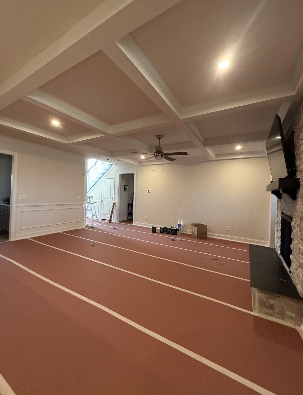 Living room with a white coffered ceiling and wainscoting freshly painted by CJC Remodeling in Lexington, SC