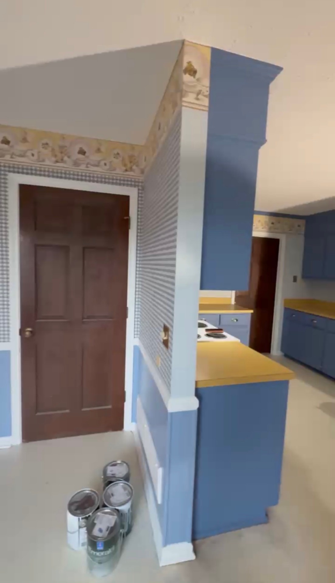 After: Second angle of refinished blue kitchen cabinets with a smooth, factory-even sprayed finish — Kitchen Cabinet Refinish, Cabinet Painting by CJC Remodeling